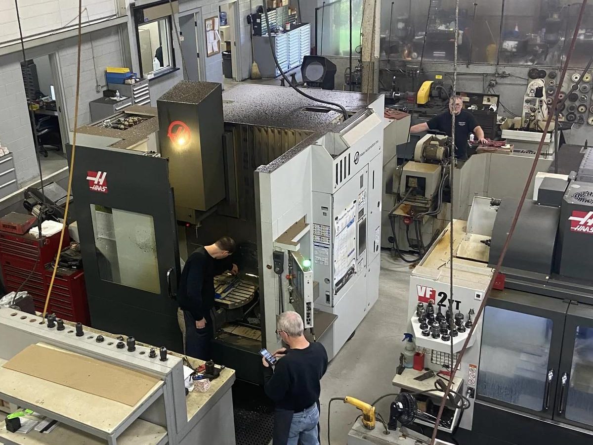 A machinist setting up a job on a Haas mill at Taylor Turning